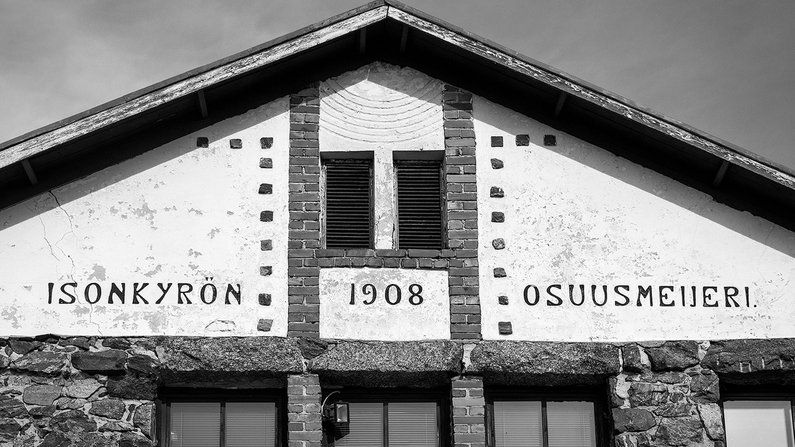Façade of Isonkyrön Osuusmeijeri, a historic 1908 Finnish dairy cooperative building that became Kyrö Distillery.