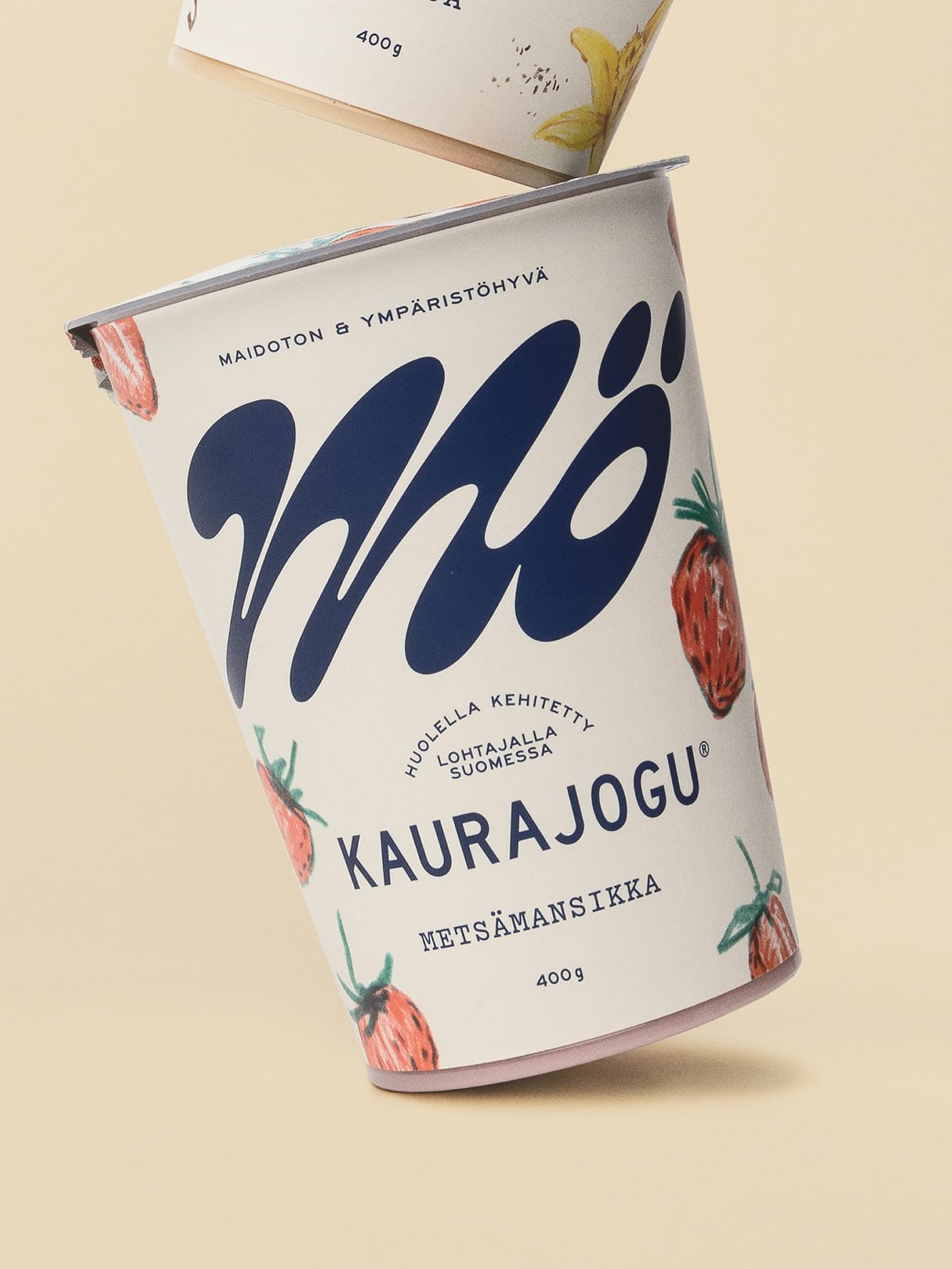 Mö Kaurajogu oat yogurt cup in wild strawberry flavour, featuring hand-drawn fruit illustration and bold navy script logo.