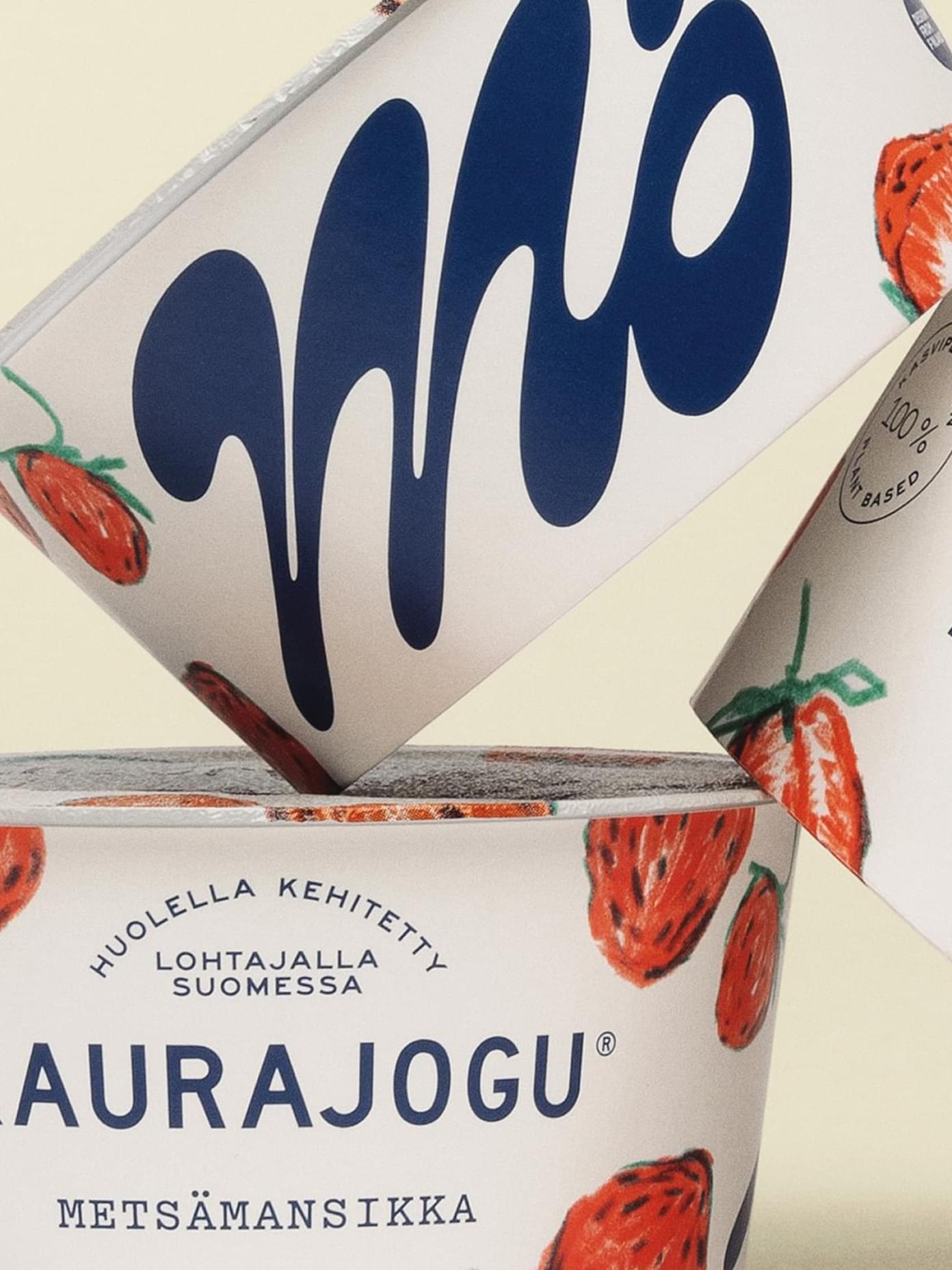 Mö Kaurajogu oat yogurt cups with hand-drawn strawberry illustrations and bold navy typography on white packaging.