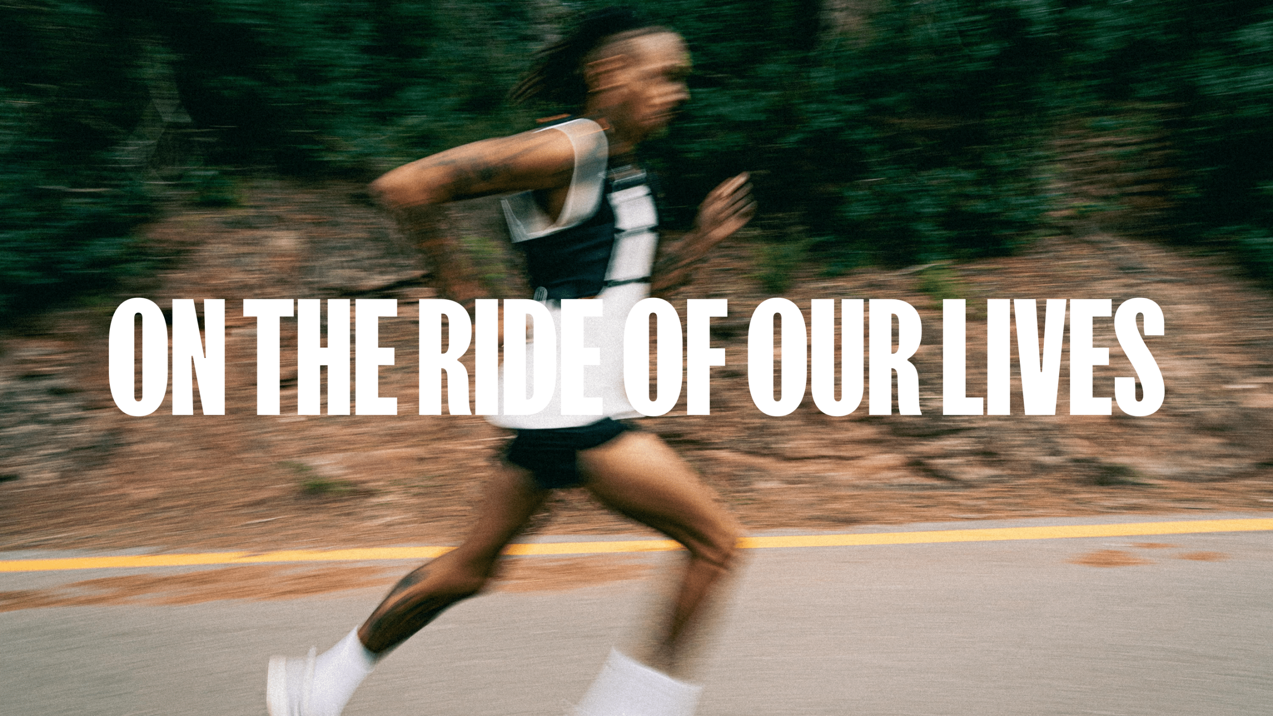 Blurred runner sprinting on a road with bold white text reading 'On The Ride Of Our Lives' for Suprey.