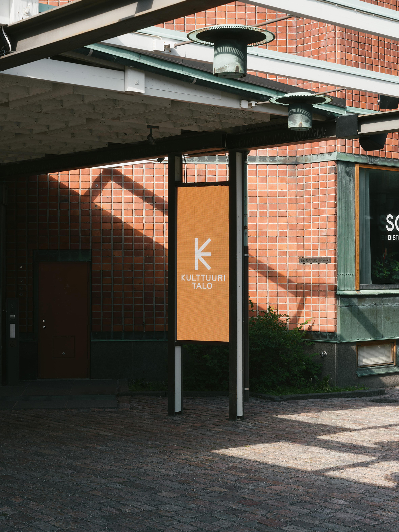 Kulttuuritalo entrance with orange branded signage.