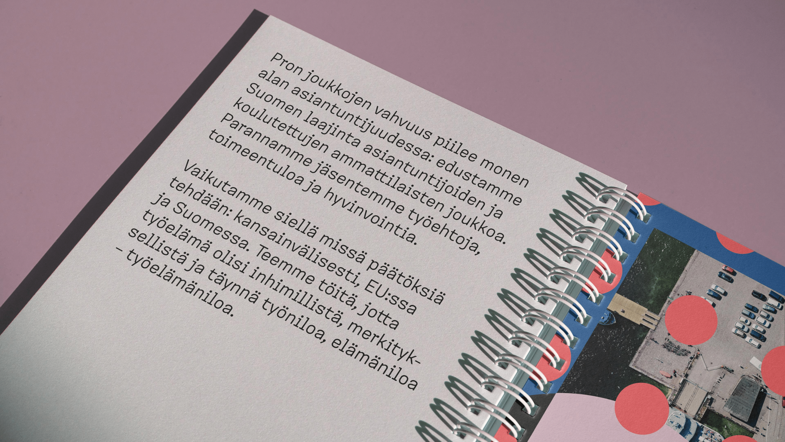 Spiral-bound Pro brand booklet open to a Finnish-language page about expertise and member wellbeing, on a pink background.