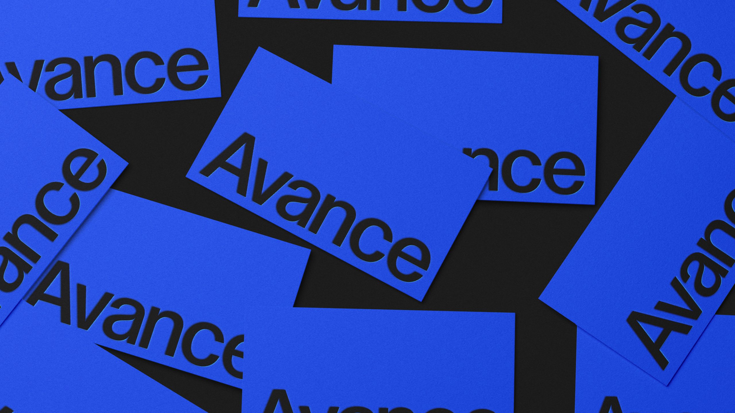 Multiple blue business cards printed with the Avance wordmark in black, scattered at various angles on a dark background.