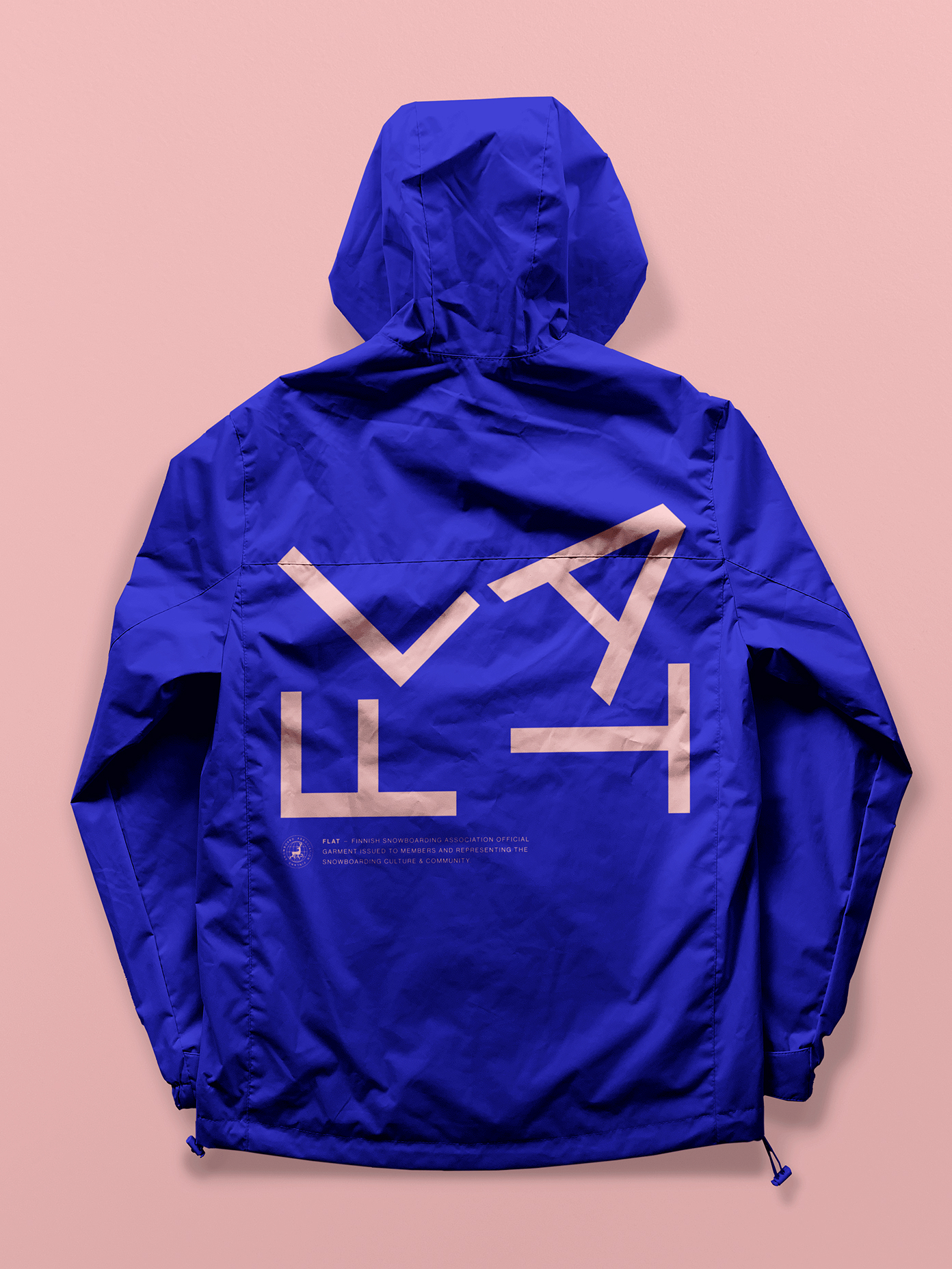 FLAT branded royal blue hooded windbreaker jacket with bold pink geometric logo on the back, displayed against a pink background.