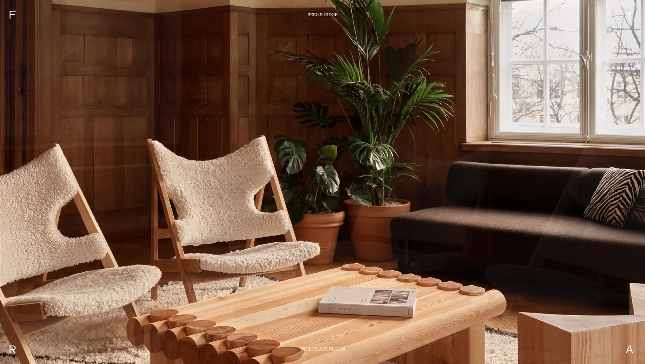 Berg & Ridge workplace interior with bouclé lounge chairs, log coffee table, dark sofa, and tropical plants against wood-panelled walls.
