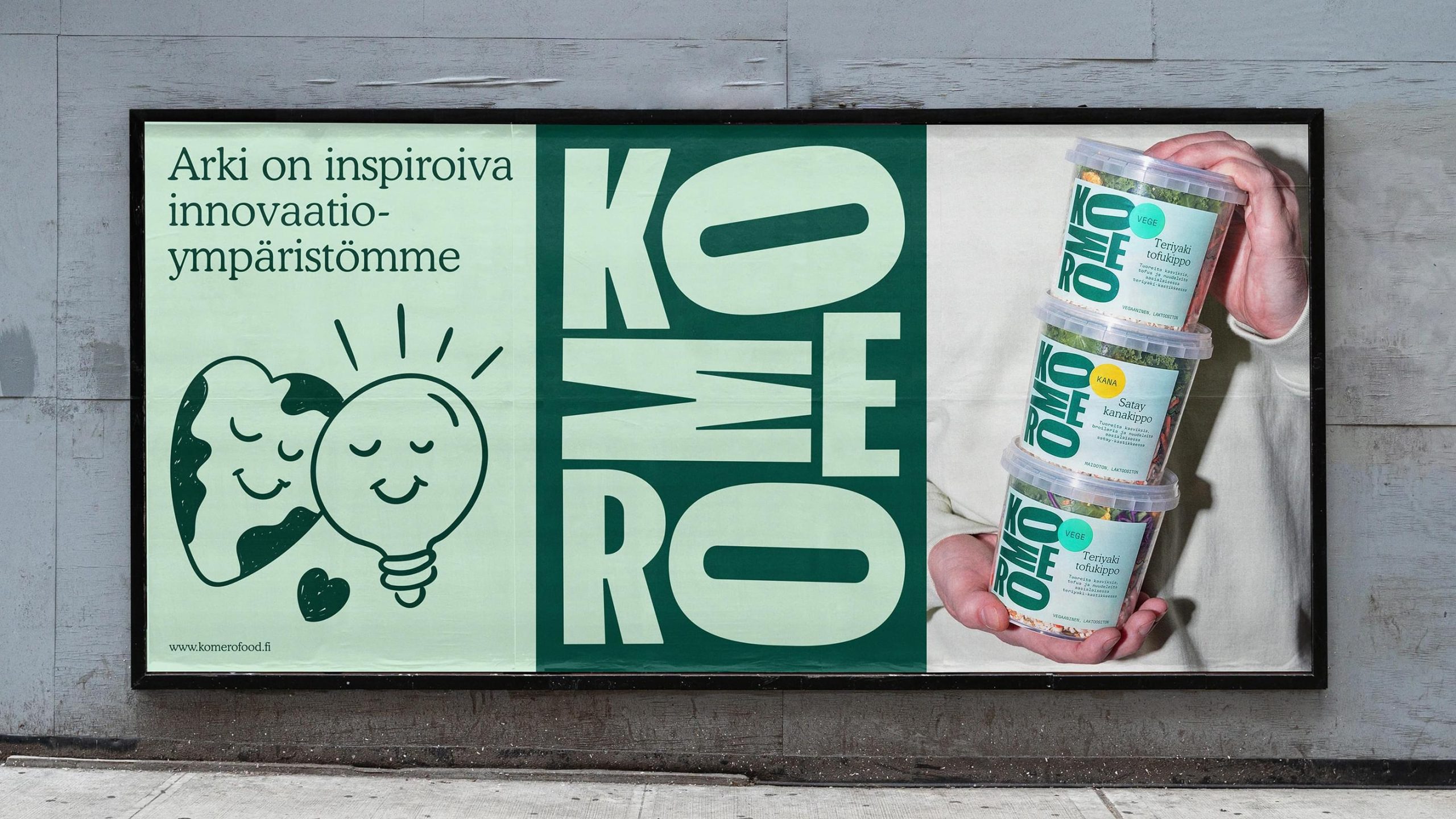 Komero Food billboard featuring earth and lightbulb illustration, bold green logo, and stacked salad pot packaging.