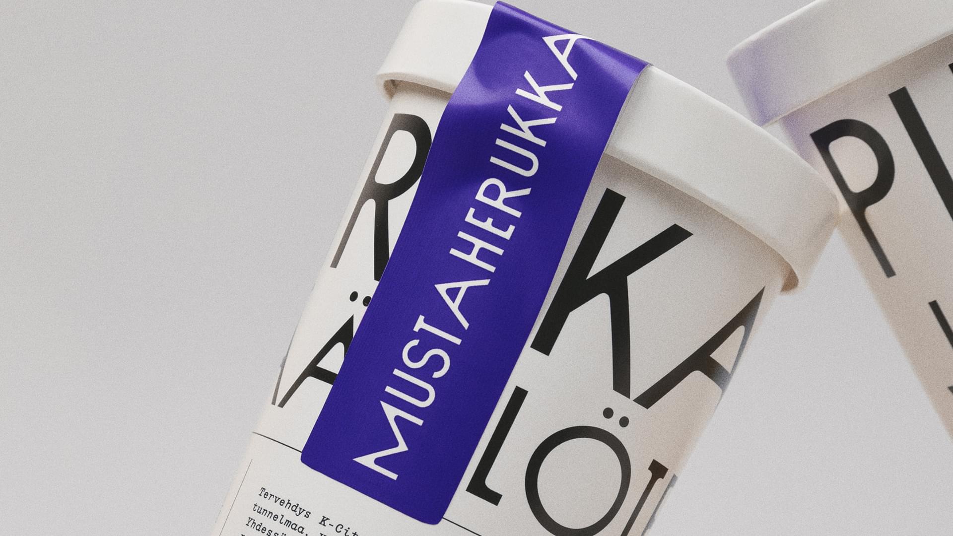 Pirkkalan branded cups with bold black typography and a purple label on a white background.